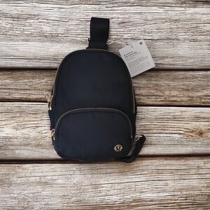 lululemon athletica Black Mini Bag with Gold Accents